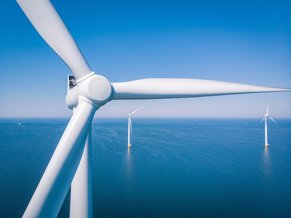 Offshore Wind Farm With Closeup Of A Turbine